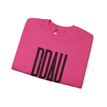 Folded Heliconia sweatshirt with black text "PRAY" on a white background. Product of Konsecrate