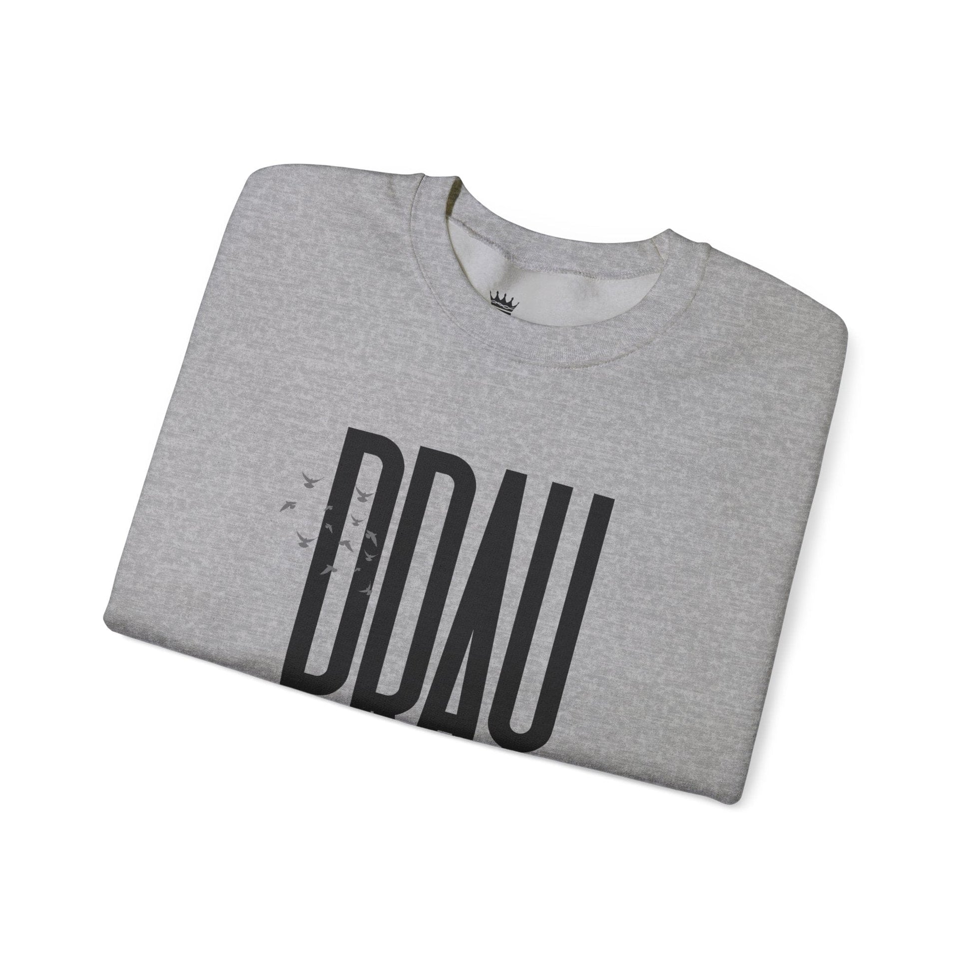 Folded sport grey sweatshirt with 'PRAY' printed on it against a white background