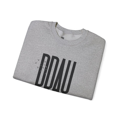 Folded sport grey sweatshirt with 'PRAY' printed on it against a white background