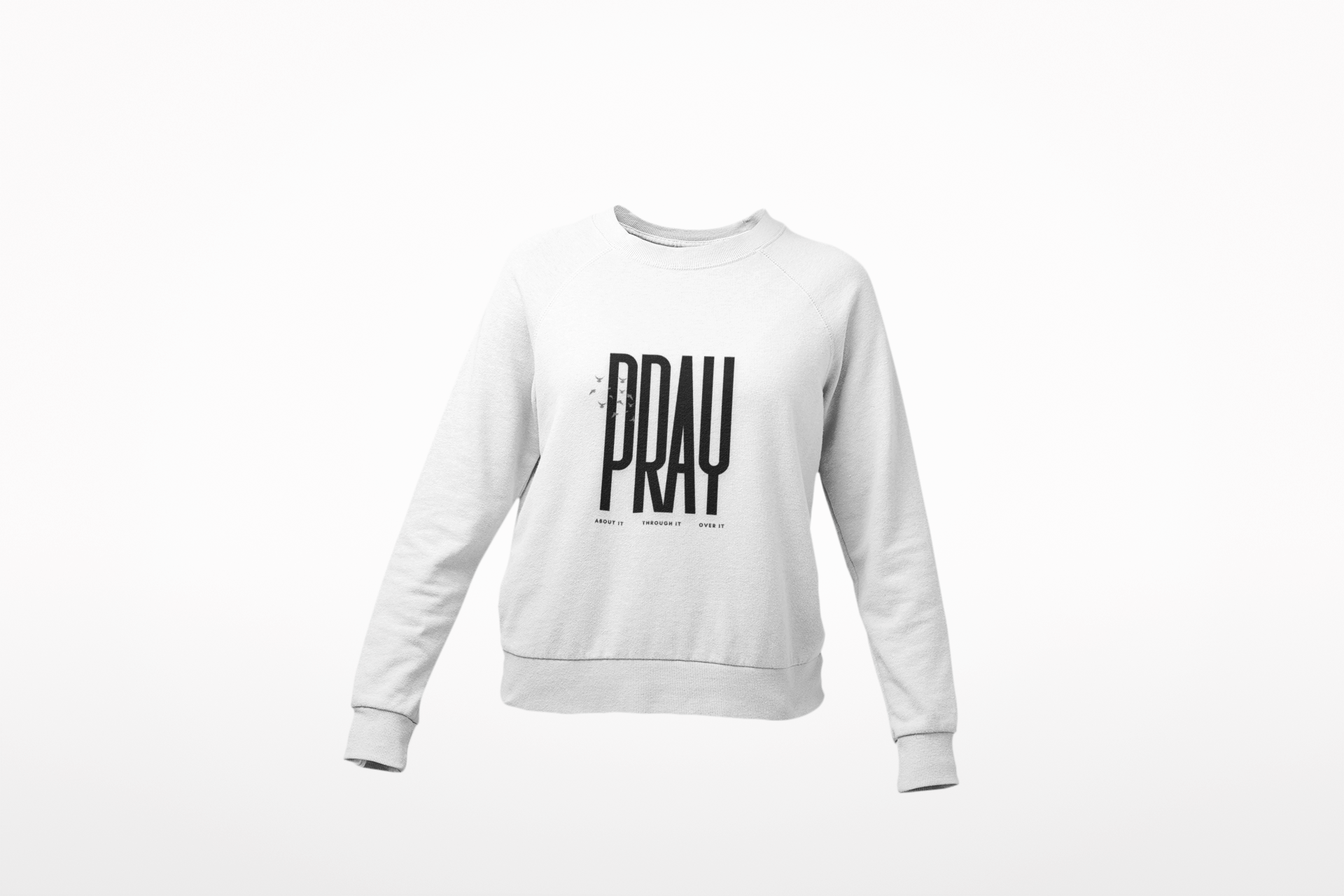 White sweatshirt with 'PRAY' printed on it against a white background