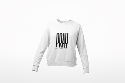 White sweatshirt with 'PRAY' printed on it against a white background