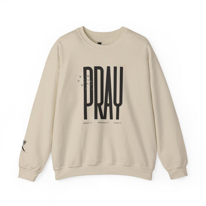 Sand sweatshirt with 'PRAY' text on a white background