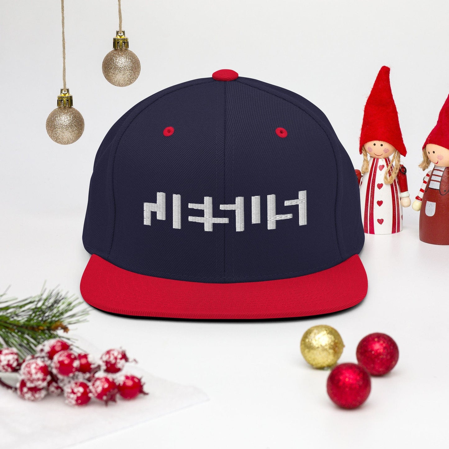 Navy/ Red snapback with "Jesus" in white embroidery with background of christmas Decor