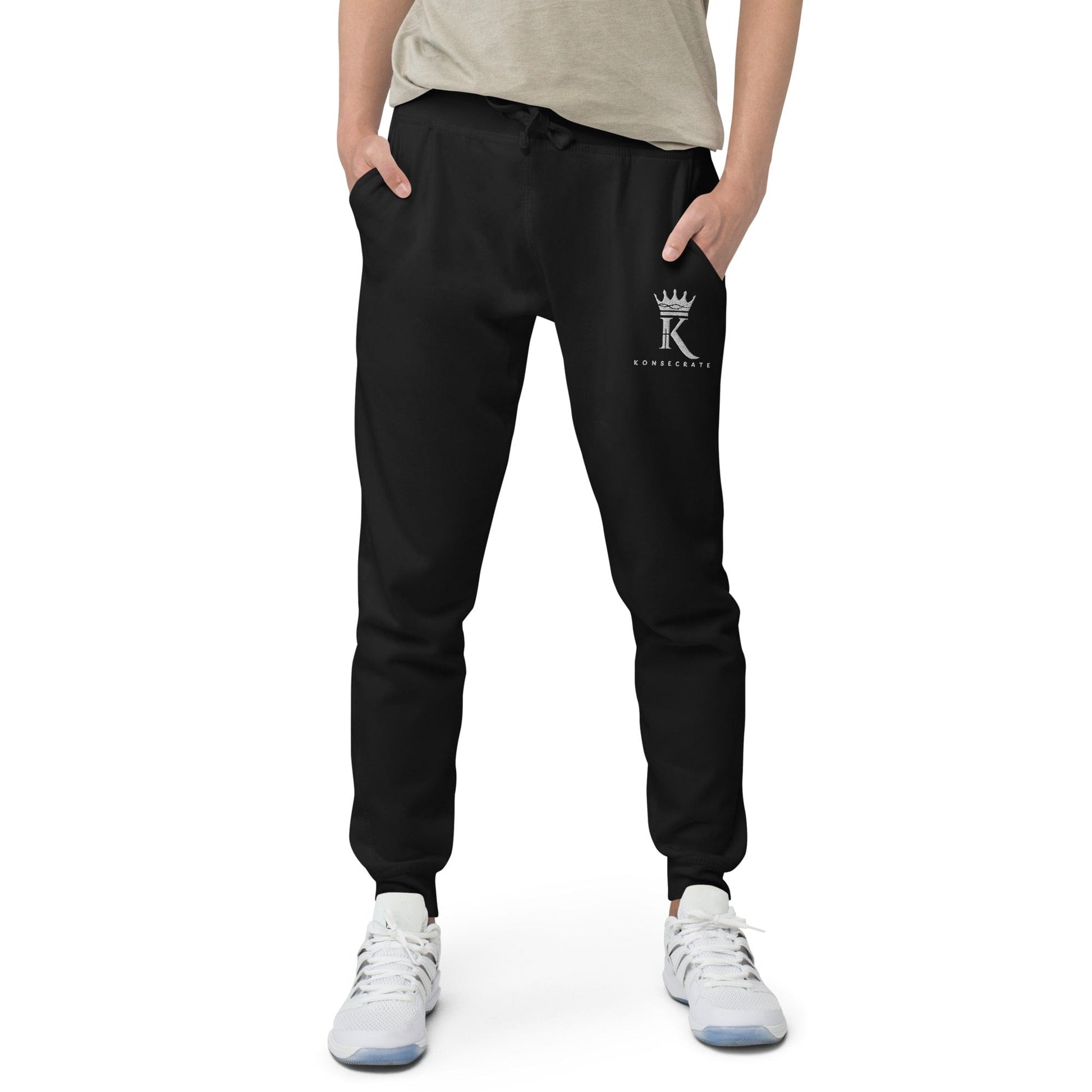 front view of man wearing black Joggers with Konsecrate Signature logo on upper left leg