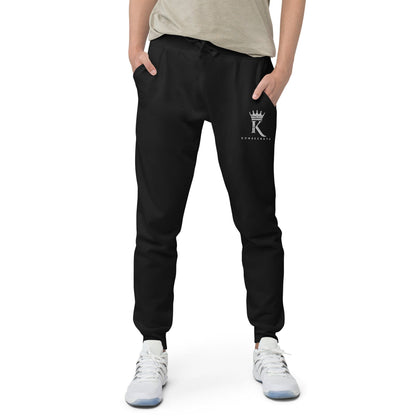 front view of man wearing black Joggers with Konsecrate Signature logo on upper left leg