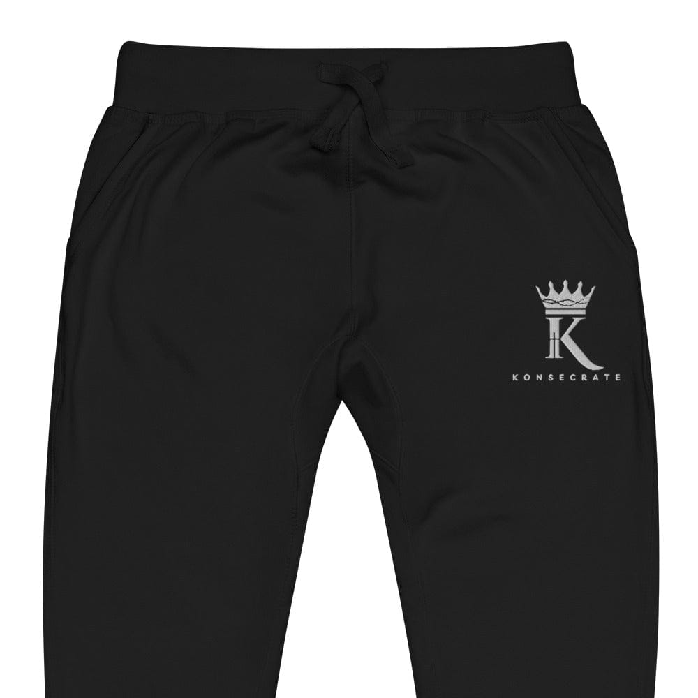 front view close-up of black Joggers with Konsecrate Signature logo on upper left leg