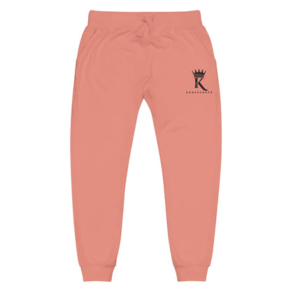 front view of dusty rose Joggers with black Konsecrate Signature logo