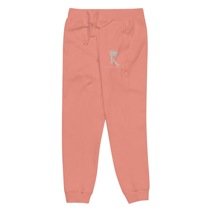 left view of dusty rose Joggers with Konsecrate Signature logo on upper left leg