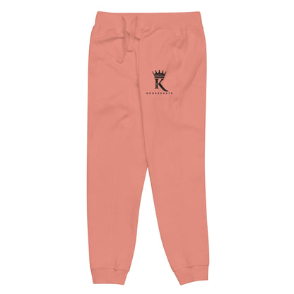 left view of dusty rose Joggers with black Konsecrate Signature logo