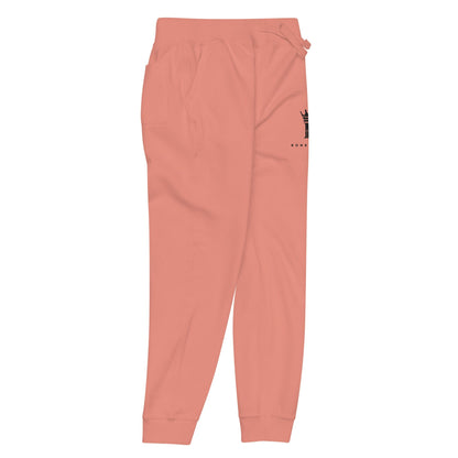 right view of dusty rose Joggers with black Konsecrate Signature logo