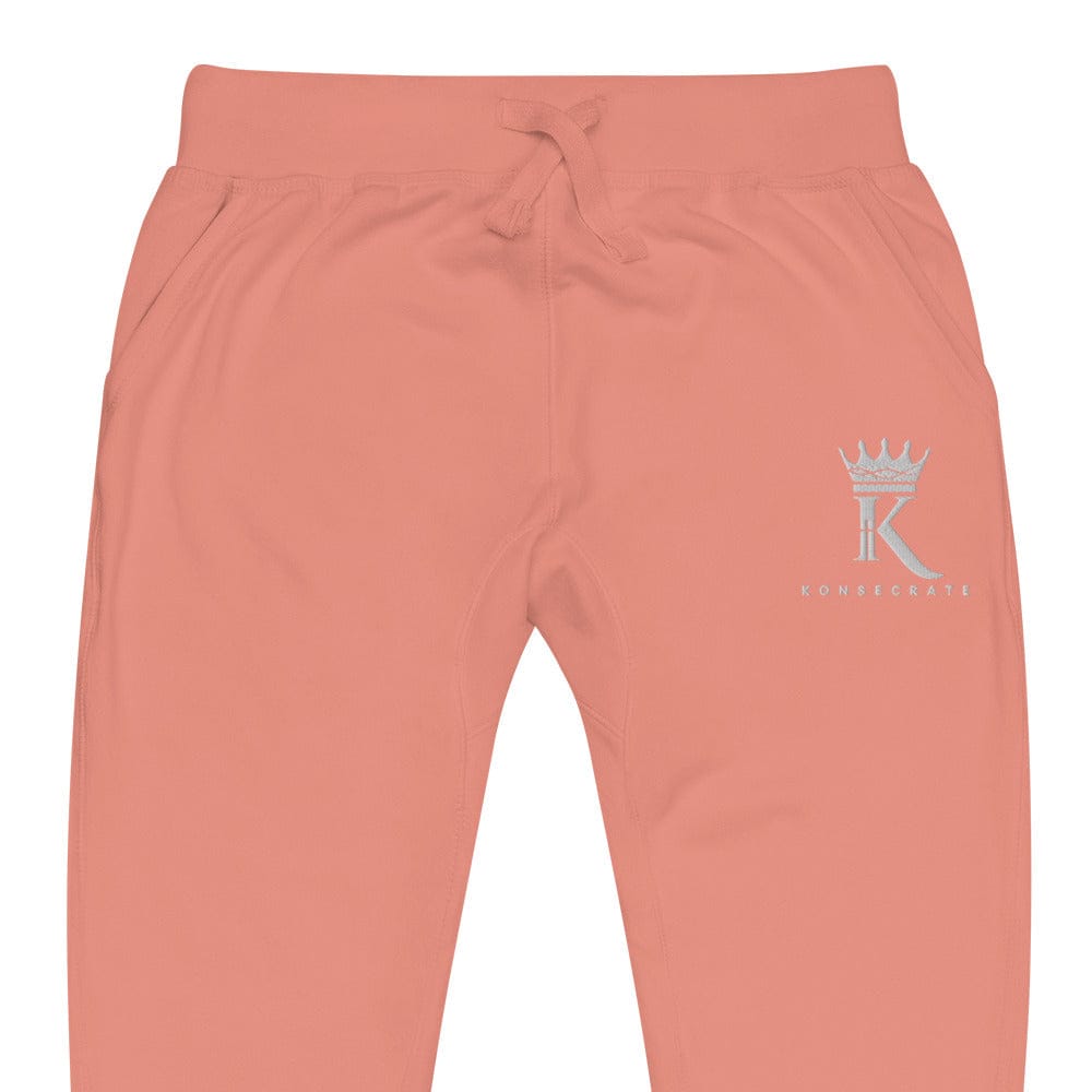 front view close-up of dusty rose Joggers with Konsecrate Signature logo on upper left leg
