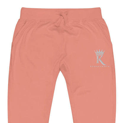 front view close-up of dusty rose Joggers with Konsecrate Signature logo on upper left leg